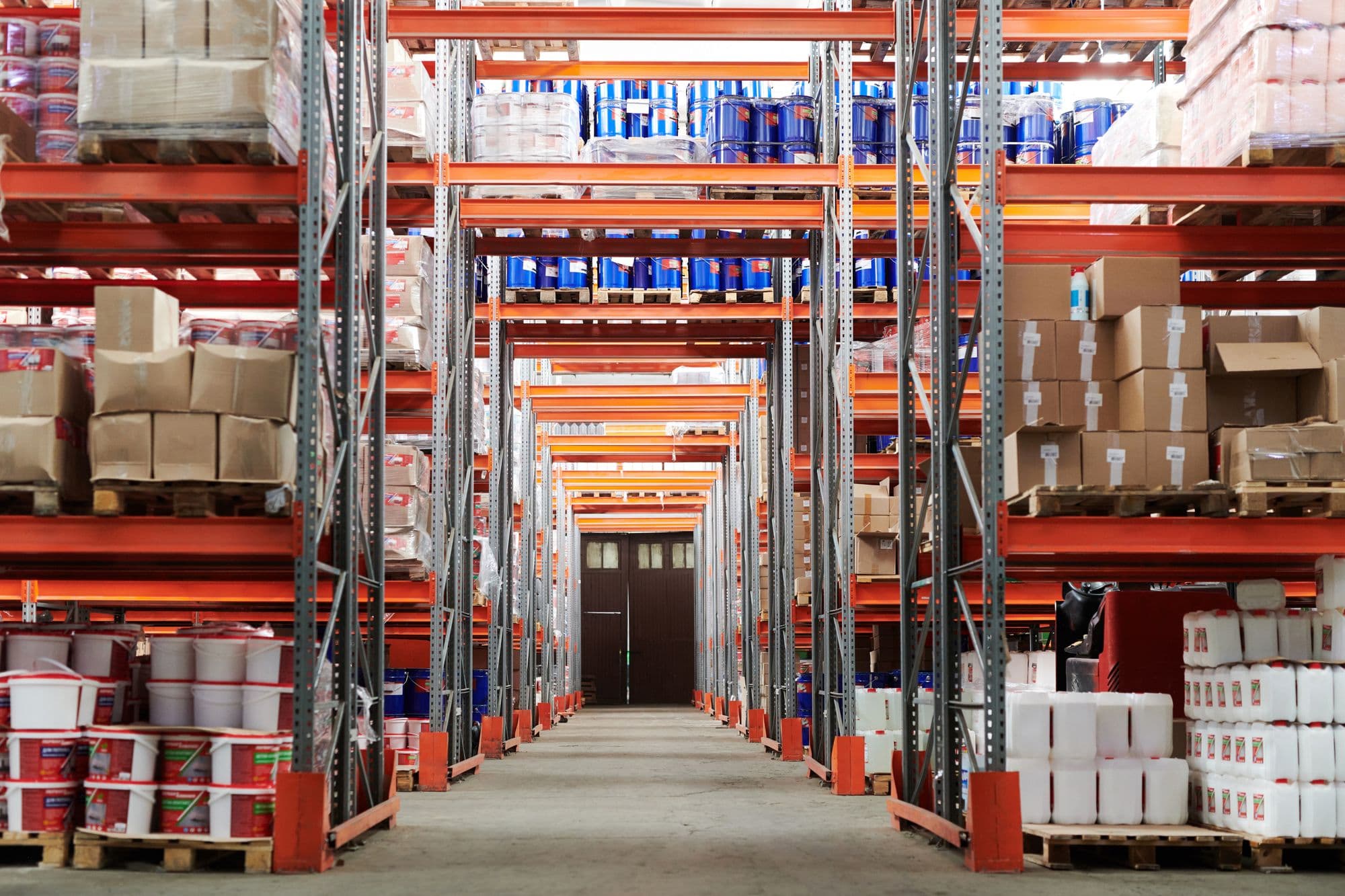 Shelves of stock in a BNP warehouse aisle