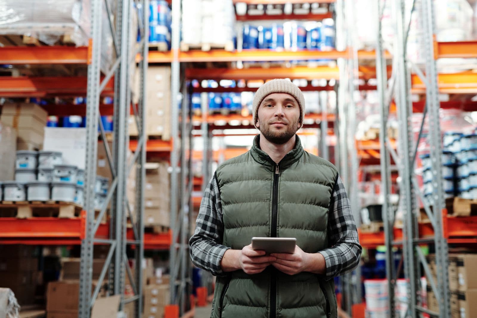 A BNP warehouse team member checking stock on a tablet